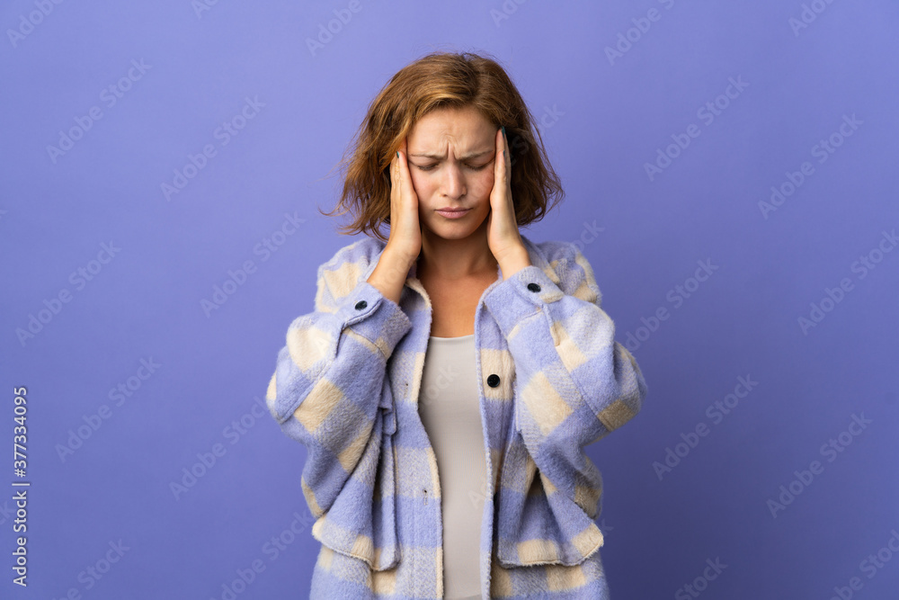 Young Georgian woman isolated on purple background with headache Young Georgian woman isolated on purple background with headache