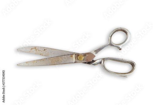 Rusty old vintage scissors on white background