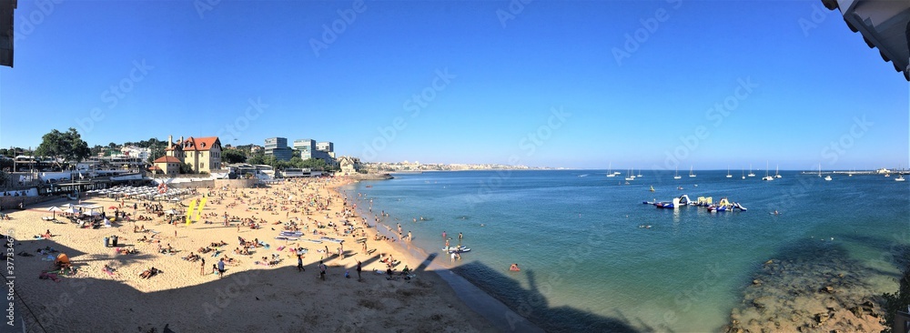 Fototapeta premium Summer afternoon beach view from seafront - Aug. 2016 - Cascais, Portugal