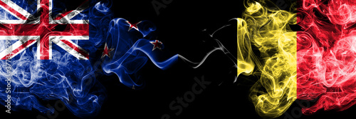 New Zealand vs Belgium, Belgian smoky mystic flags placed side by side. Thick colored silky abstract smoke flags