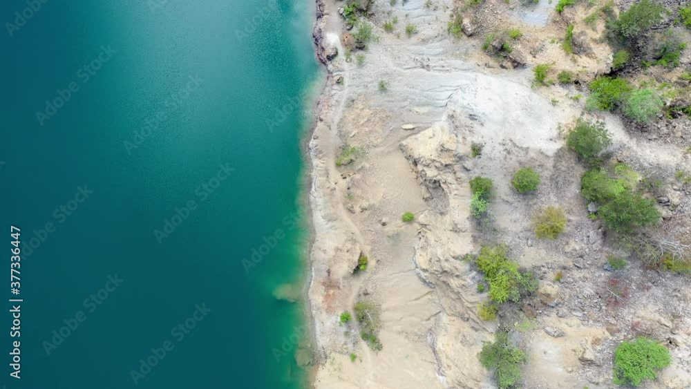 Mine quarry shot from above. Beautiful blue lake with white rocks. Mine quarry shot from above. Beautiful blue lake with white rocks.