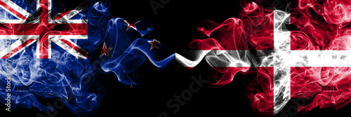 New Zealand vs Denmark, Danish smoky mystic flags placed side by side. Thick colored silky abstract smoke flags