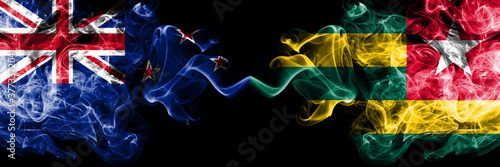 New Zealand vs Togo  Togolese smoky mystic flags placed side by side. Thick colored silky abstract smoke flags