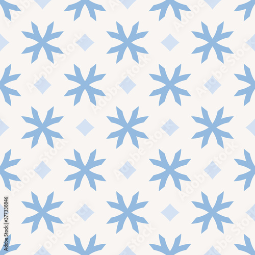 Winter seamless pattern. Vector geometric background with stylized snowflakes, diamonds. Christmas and New Year texture. Elegant blue and white ornament. Repeat design for decor, wrapping, wallpapers