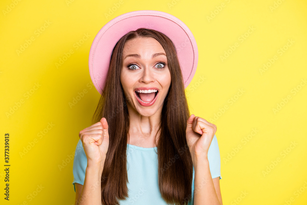 Portrait of delighted crazy girl enjoy rejoice incredible travel trip lottery lucky win raise fists scream wear blue look isolated over bright color background Portrait of delighted crazy girl enjoy rejoice incredible travel trip lottery lucky win raise fists scream wear blue look isolated over bright color background