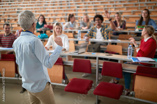 Fotografia, Obraz Female professor lecturing the students