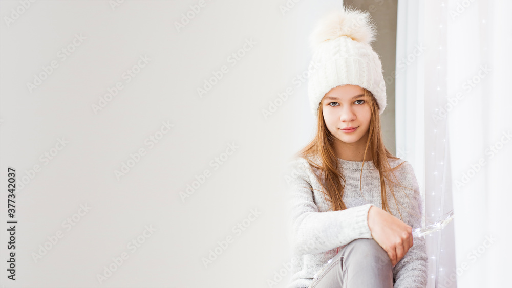 Merry Christmas and Happy Holidays! The morning before Christmas. Portrait of a beautiful girl Merry Christmas and Happy Holidays! The morning before Christmas. Portrait of a beautiful girl