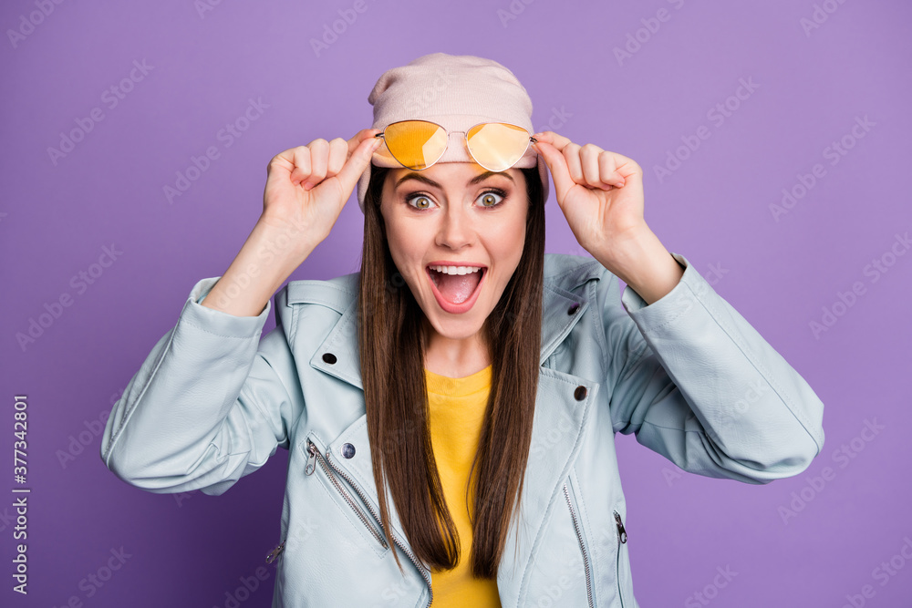 Portrait of astonished positive cheerful girl youngster cant believe her eyesight touch spectacles impressed scream wear look good outfit isolated over purple color background
