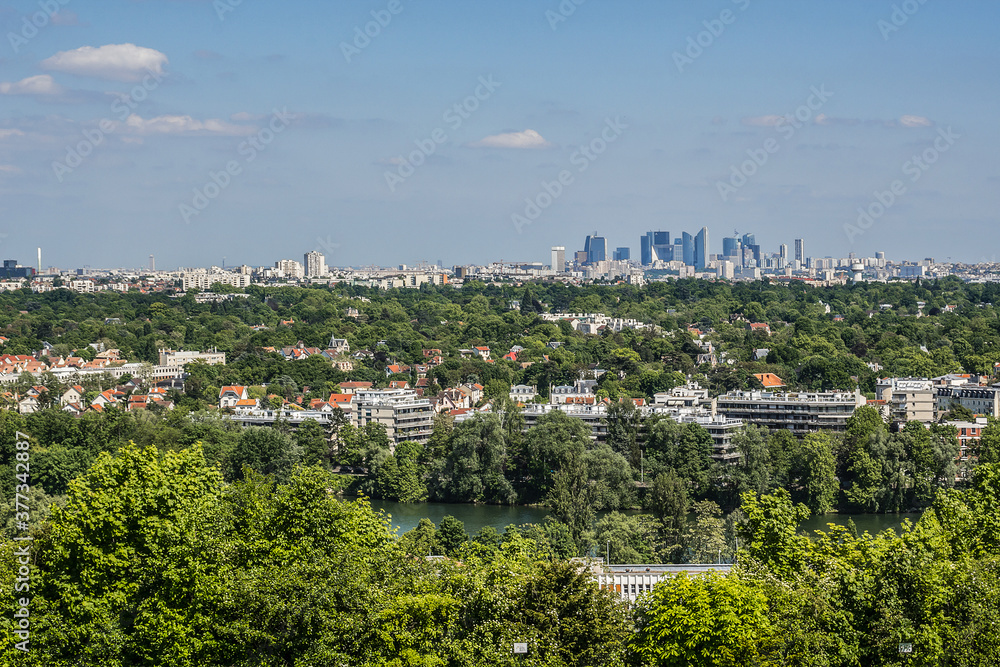 Beautiful view of valley of Seine River and panorama of Paris on backgrounds from lookout near Chateau de Saint-Germain-en-Laye in city Saint-Germain-en-Laye (13 miles west of Paris), France.