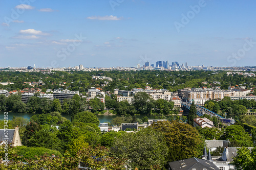 Beautiful view of valley of Seine River and panorama of Paris on backgrounds from lookout near Chateau de Saint-Germain-en-Laye in city Saint-Germain-en-Laye (13 miles west of Paris), France.