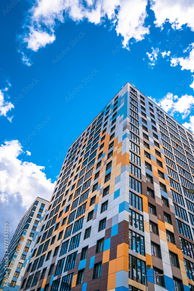 Multi-storey residential modern house against the sky. Residential area.