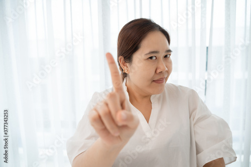 Asian plus size woman pointing with finger up and angry expression, showing no gesture Free Download Asian plus size woman pointing with finger up and angry expression, showing no gesture - GFXLoad