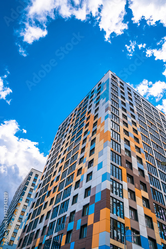 Multi-storey residential modern house against the sky. Residential area.
