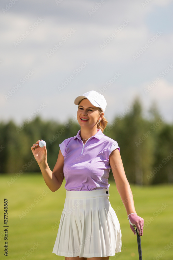 Golfer hits with a club during the tournament Golfer hits with a club during the tournament