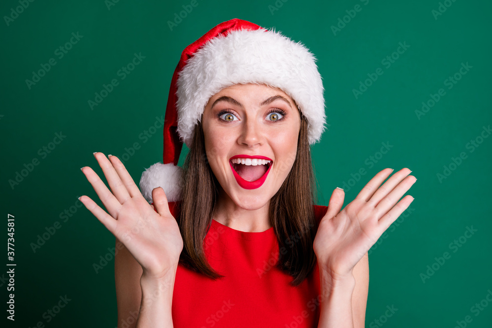 Closeup photo attractive cute funny snow girl lady red pomade miracle atmosphere raise arms crazy good news wear santa claus cap red dress isolated green pastel color background Closeup photo attractive cute funny snow girl lady red pomade miracle atmosphere raise arms crazy good news wear santa claus cap red dress isolated green pastel color background