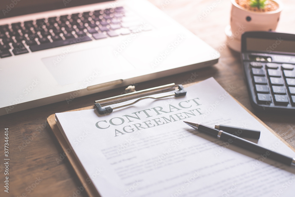 Legal contract documents are placed on the desk in the office.Real estate purchase contract signing, signing important document Legal contract documents are placed on the desk in the office.Real estate purchase contract signing, signing important document