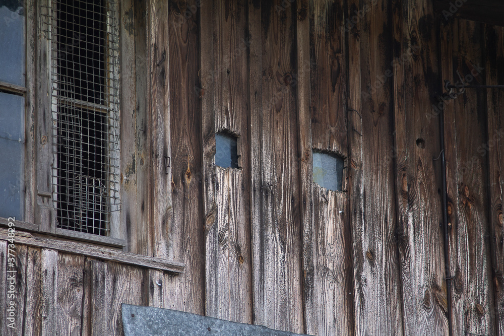 Old house with a lot of wood. Marked by decay. Old house with a lot of wood. Marked by decay.