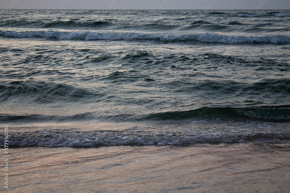 Fototapeta premium The waves break on the beach. Taken here at the Baltic Sea.