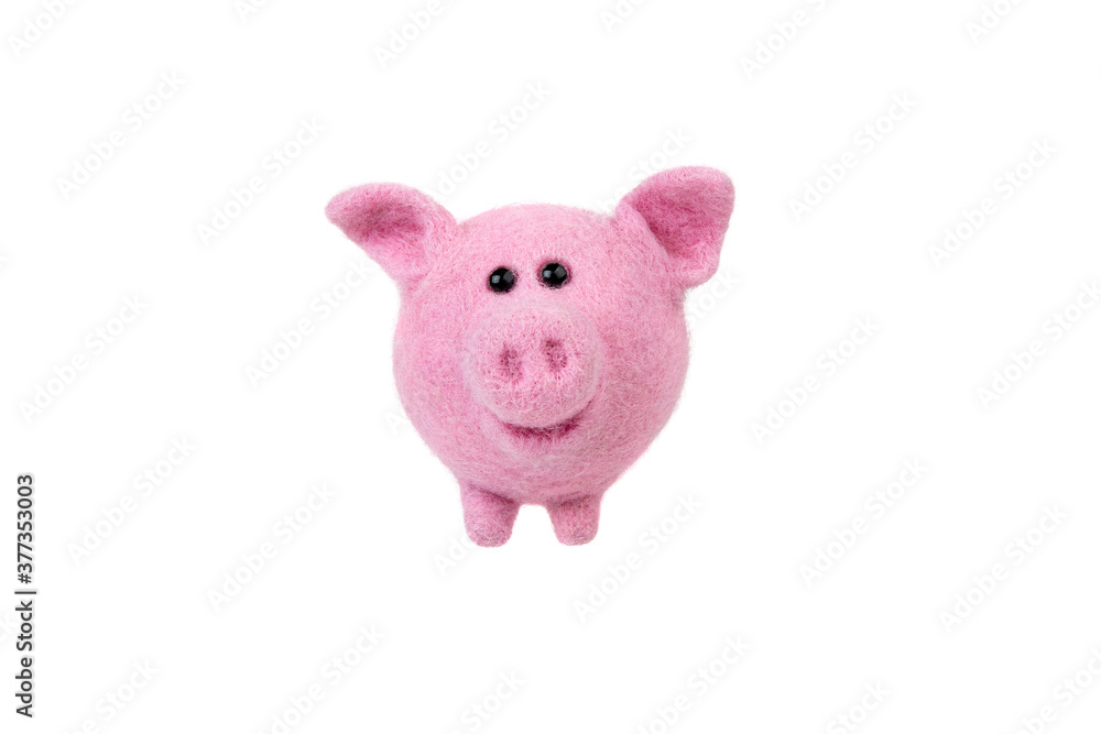 Handmade felt toy isolate on a white background. Pink piglet made of wool. Soft toy pig. Handmade felt toy isolate on a white background. Pink piglet made of wool. Soft toy pig.