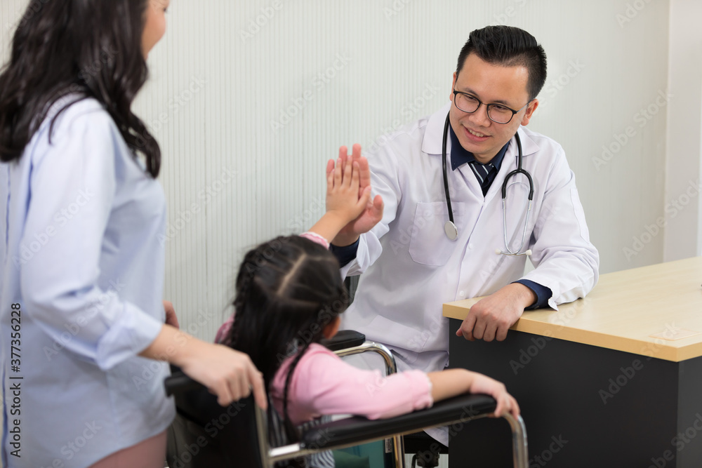 asian doctor give high five with little girl after medical checkup asian doctor give high five with little girl after medical checkup