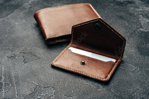 New brown leather wallet on dark background
