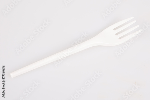 White disposable recyclable spoon and fork isolated on white background