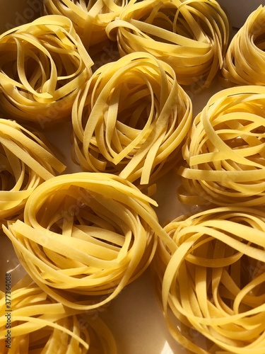 Tagliatelle pasta in a white box macro