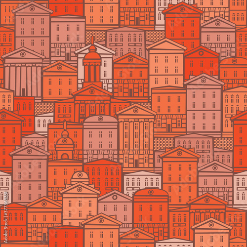 Decorative seamless pattern with old buildings in red and orange colors. European town with cartoon houses. Vector cityscape background in retro style  suitable for wallpaper  wrapping paper  fabric