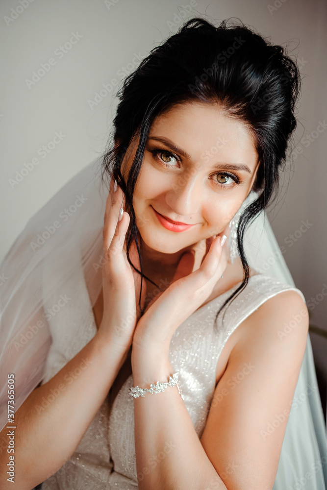 Portrait of a cute dark-haired bride
