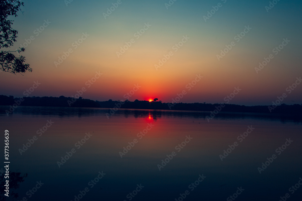 Sunrise on Amazon forest river
