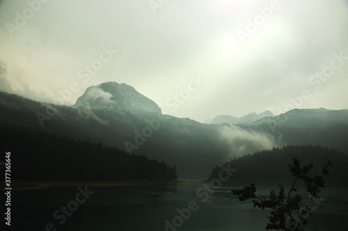 Gloomy mountain near the lake  foggy day in the Montenegro  travel to europe