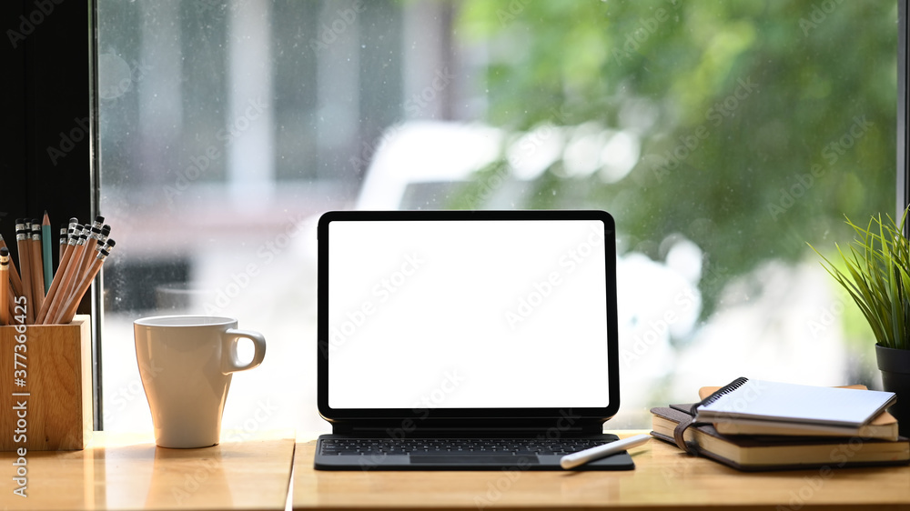 Workspace digital tablet computer, coffee, notebook on wooden table. Workspace digital tablet computer, coffee, notebook on wooden table.