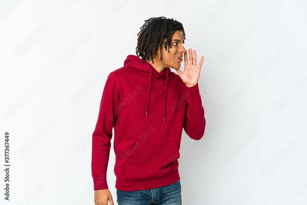 Young african american rasta man is saying a secret hot braking news and looking aside Young african american rasta man is saying a secret hot braking news and looking aside