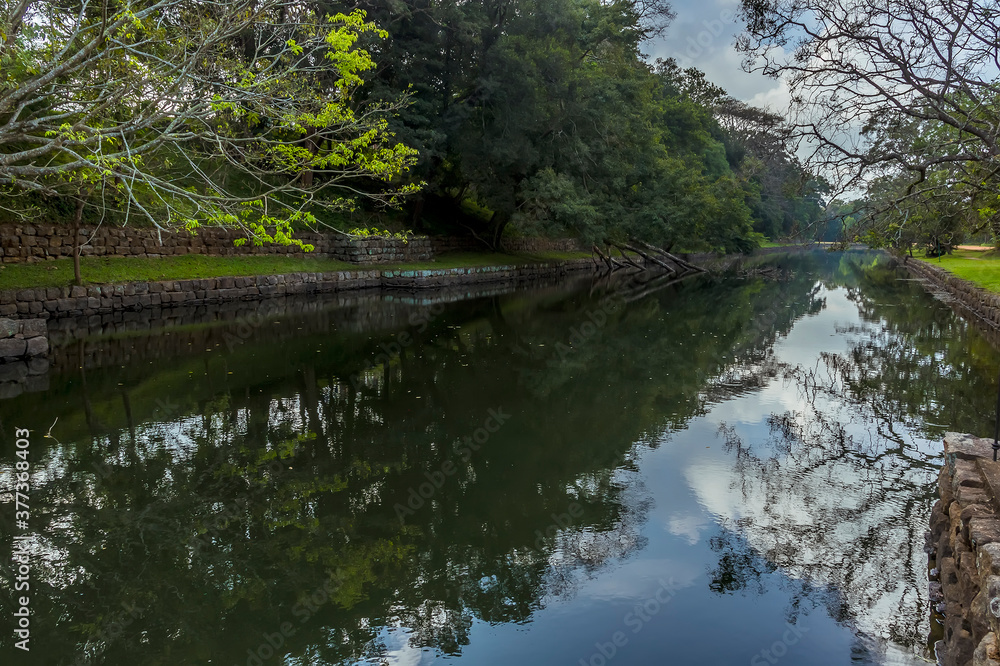 Reflections in the moat around the rock fortress of Sigiriya, Sri Lanka