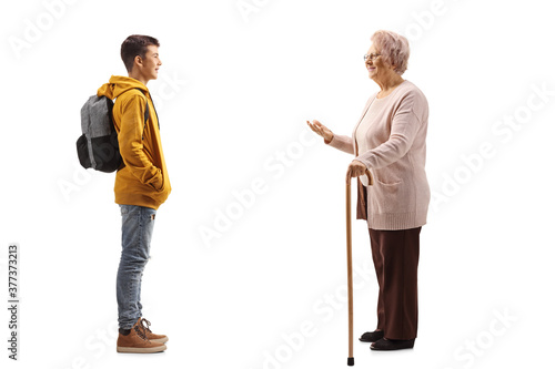 Full length profile shot of a grandmother talking to her teenage grandson