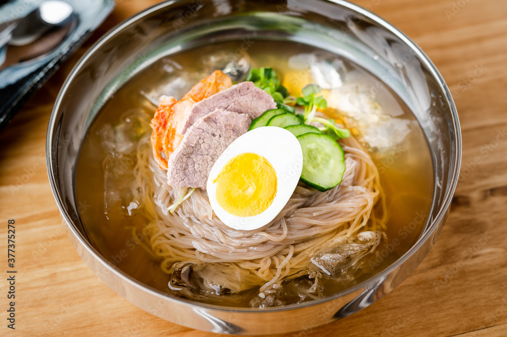 korean style cold noodle in silber bowl korean style cold noodle in silber bowl
