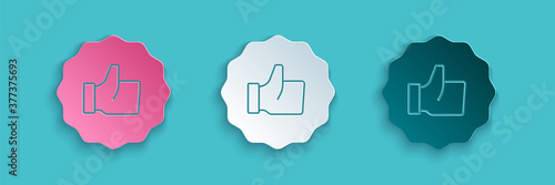 Paper cut Hand thumb up icon isolated on blue background. Paper art style. Vector.