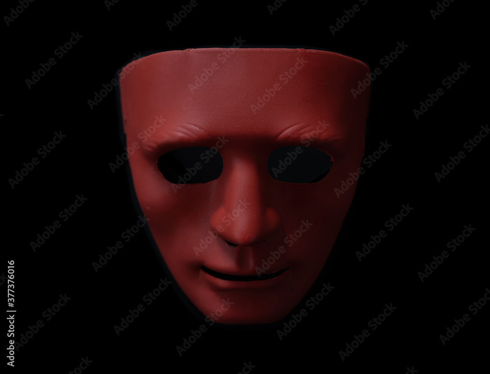 Halloween house decorations, red mask on a black background. Halloween house decorations, red mask on a black background.