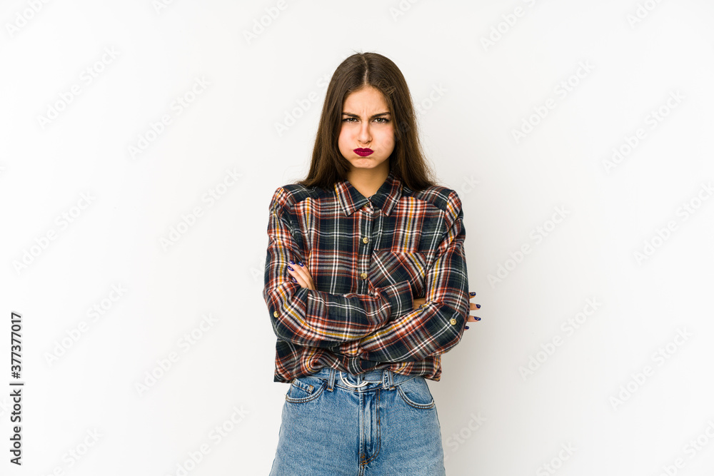 Young caucasian woman isolated on white background blows cheeks, has tired expression. Facial expression concept. Young caucasian woman isolated on white background blows cheeks, has tired expression. Facial expression concept.