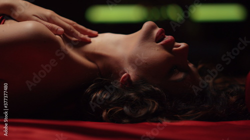Εκτύπωση καμβά Seductive girl touching lips in bed