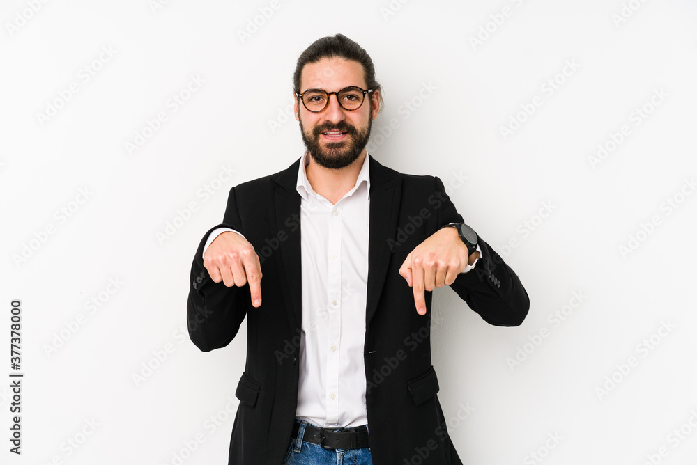 Young caucasian business man isolated on a white background points down with fingers, positive feeling. Young caucasian business man isolated on a white background points down with fingers, positive feeling.