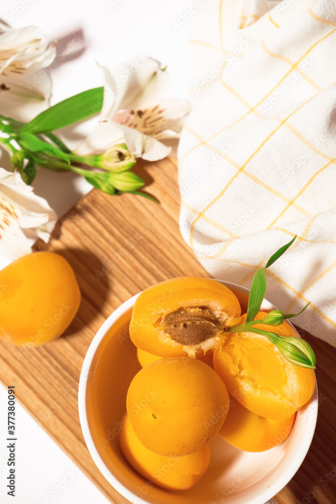 Composition of fresh apricots for culinary dessert class or wallpaper. Summer fruit harvest. Healthy vegan eating. Raw recipe. High quality photo