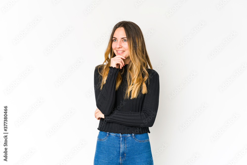 Young caucasian woman isolated on white background relaxed thinking about something looking at a copy space. Young caucasian woman isolated on white background relaxed thinking about something looking at a copy space.