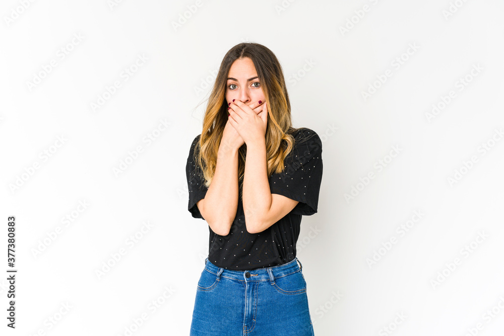Young caucasian woman isolated on white background covering mouth with hands looking worried. Young caucasian woman isolated on white background covering mouth with hands looking worried.