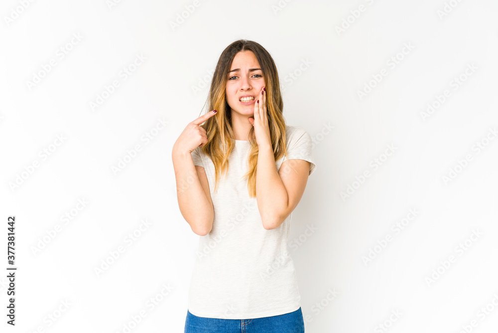 Young caucasian woman isolated on white background having a strong teeth pain, molar ache. Young caucasian woman isolated on white background having a strong teeth pain, molar ache.