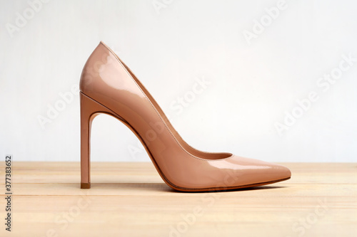 Fashion high heels women shoes beige color. Stiletto shoe style in ladies wardrobe. High fashion and formal female accessory. 