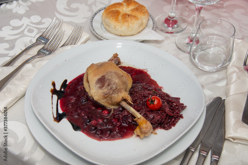 duck leg with red cabbage and fruit jam