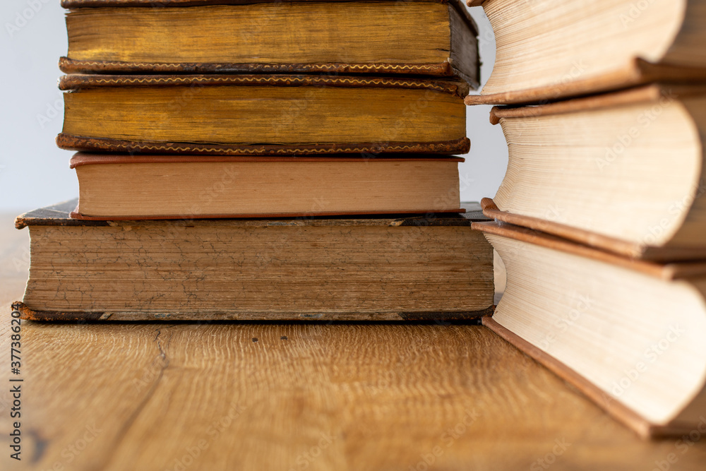 Stack of books on a wooden table Stack of books on a wooden table