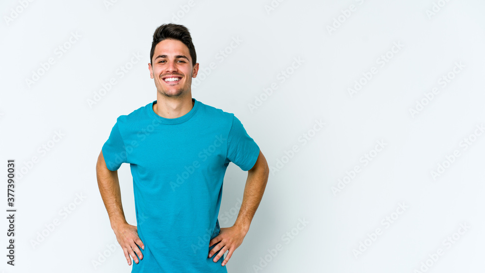 Young caucasian man isolated on white background confident keeping hands on hips. Young caucasian man isolated on white background confident keeping hands on hips.