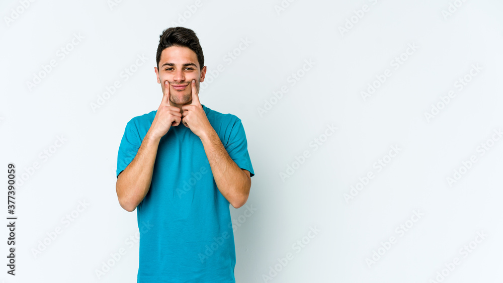 Young caucasian man isolated on white background doubting between two options. Young caucasian man isolated on white background doubting between two options.